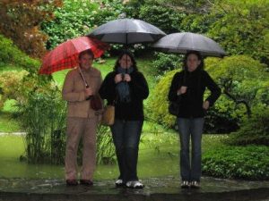 standing under the umbrellas in the rain in Bellagio