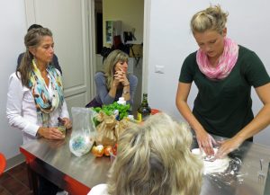 learning how to make pasta at an Italian cooking class