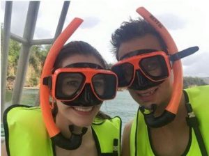 a honeymoon couple with snorkel masks on in St. Lucia