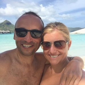a honeymoon couple on the beach in Tahiti