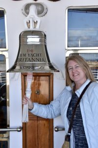 Annie ringing the bell on the Royal Yacht Britannia in Edinburgh