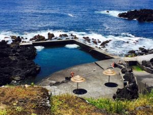 a seaside pool and blue ocean on the Azores Islands Portugal