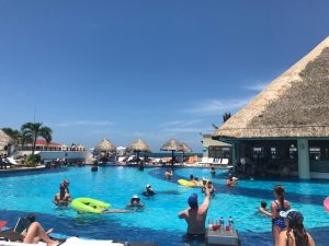people playing in the large pool of the Mexican Riviera resort 