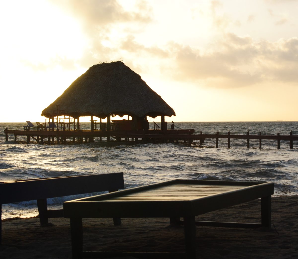the beach and overwater cabana in belize