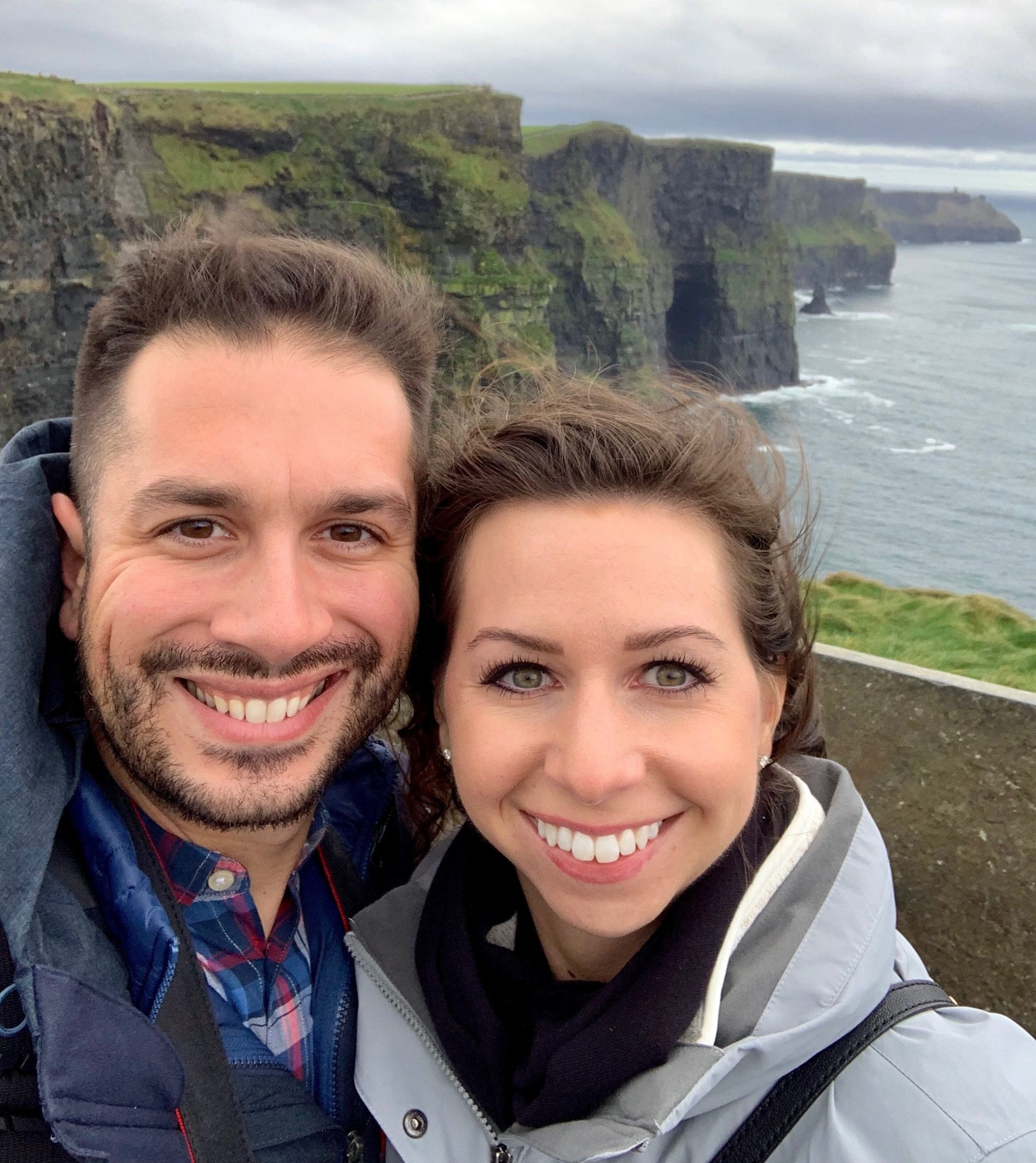 couple with Irish Cliffs in the backgrount