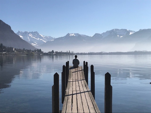 woman at the end of a dock in Switzerland