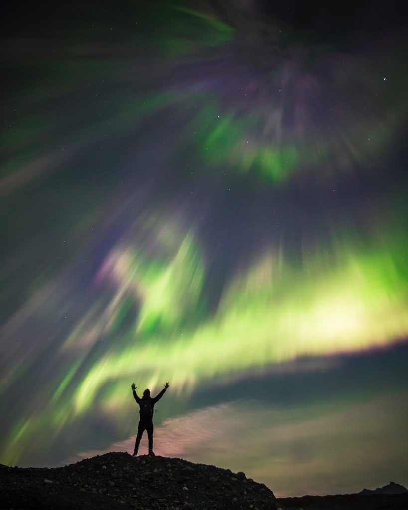 silhouette against the Aurora Northern Lights Alaska
