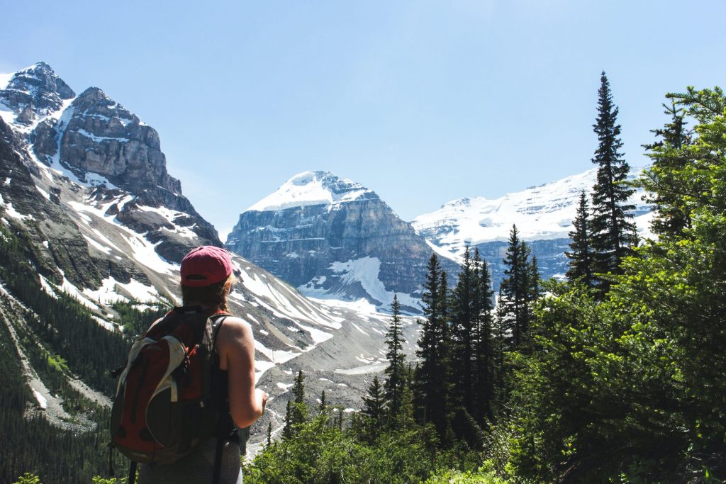Enjoy the view of huge snow-capped mountains and lush evergreen forest when you hikethe Canadian Rockies
