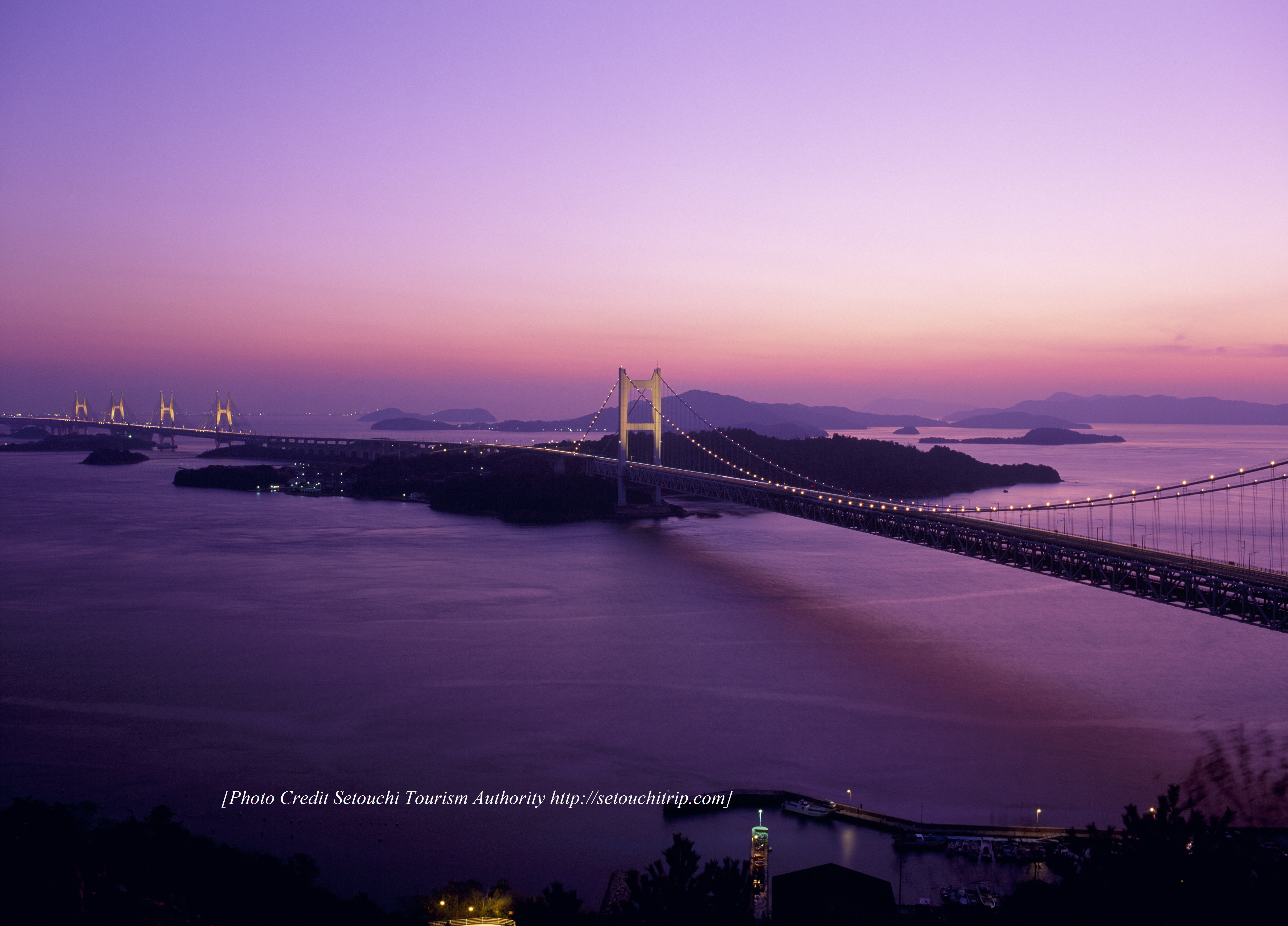 aerial view of bridge over the bay at sunset in the Setouchi region of Japan
