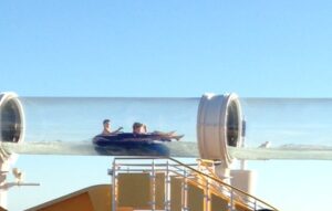 children in a water filled tube at a water park on Disney Cruise