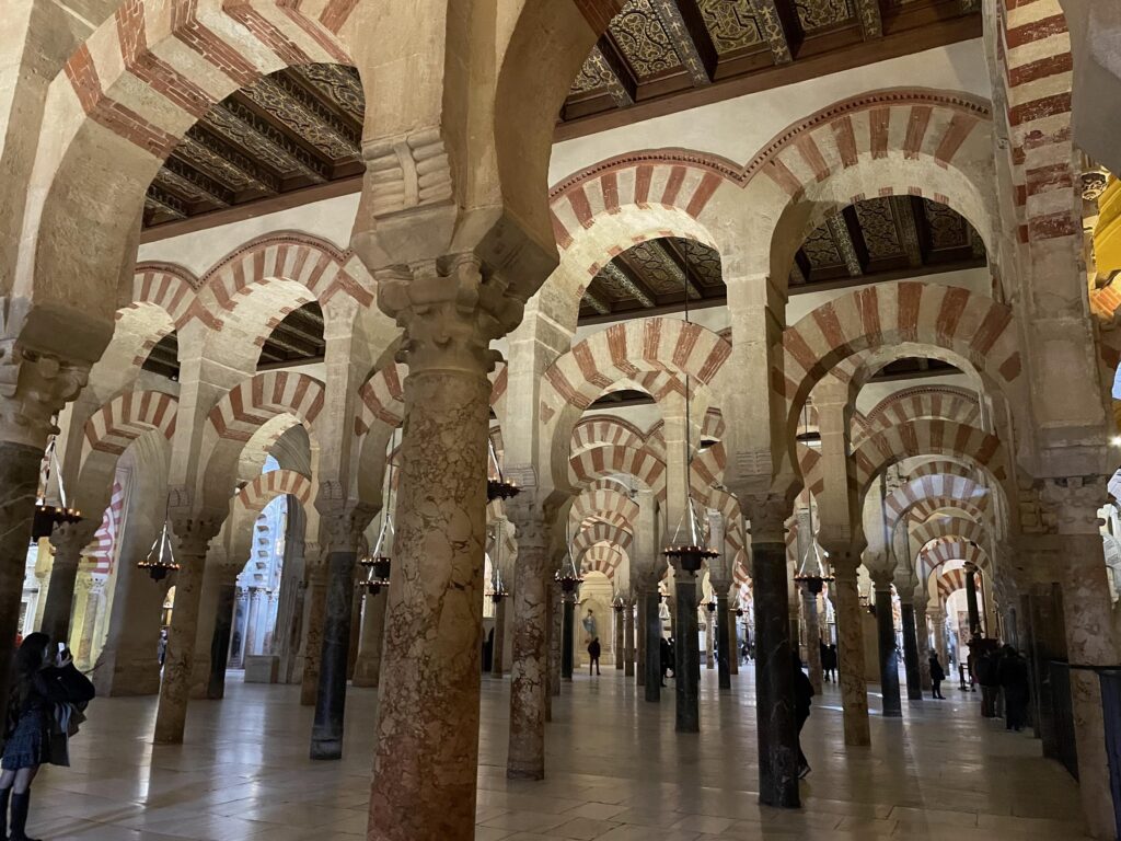 ornate repeating archways unique architecture at the Mezquita Cordoba in Southern Spain