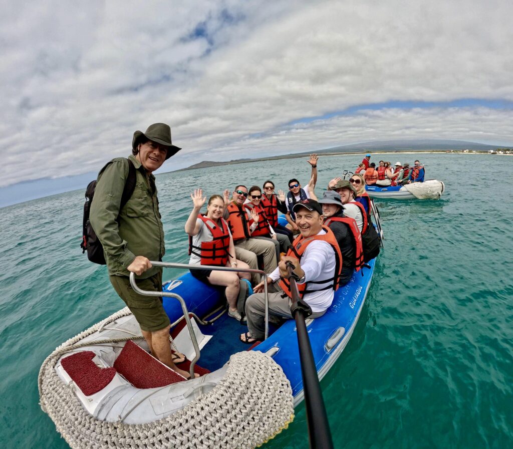 Galapagos group aboard a small inflatable zodiac on the way to the islands