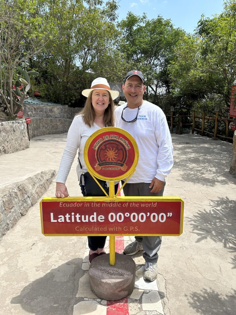 Ann and her husband at the Equator in Ecuador