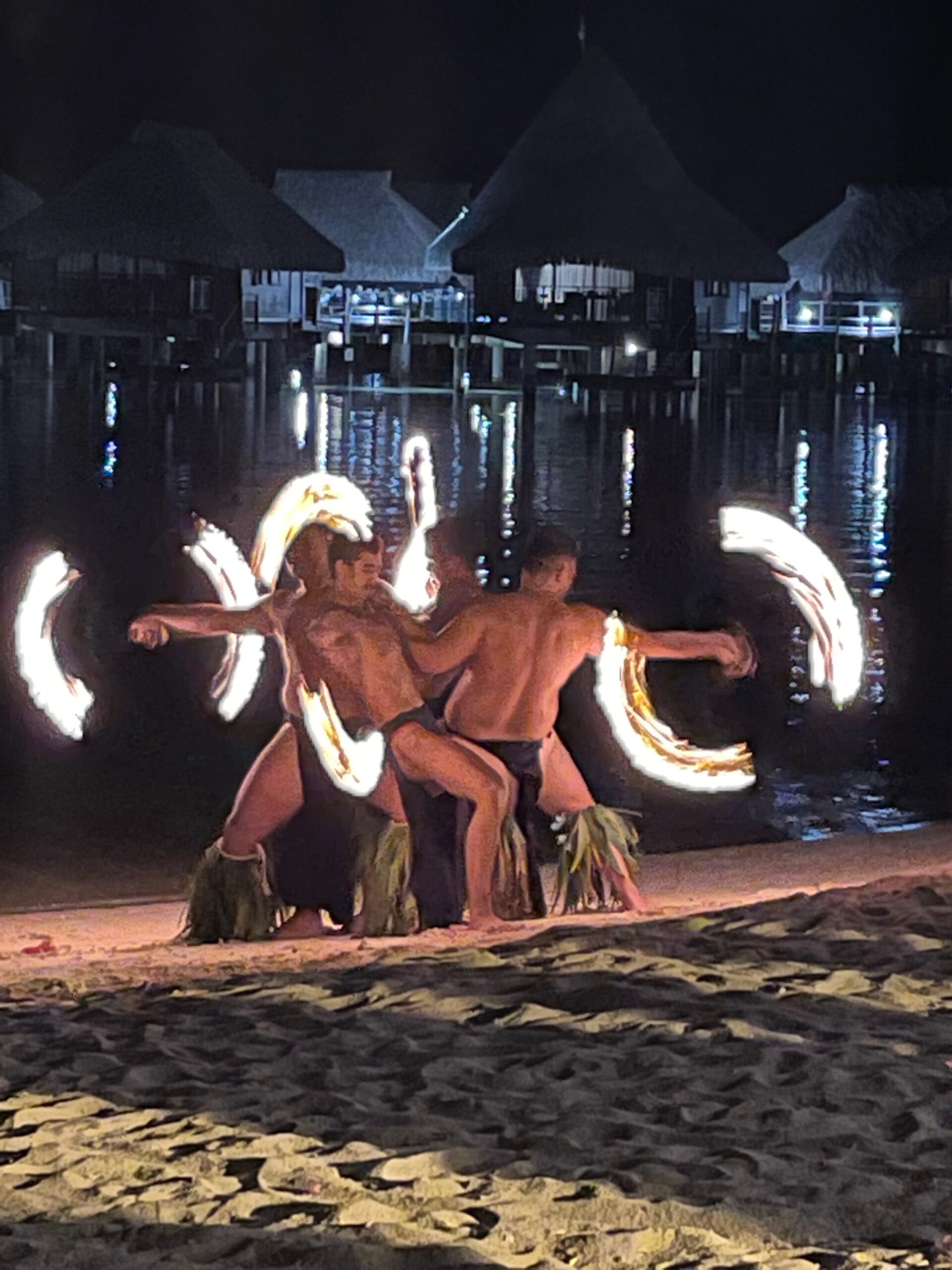 fire dancers on the beach in Tahiti celebrating a Tahiti honeymoon