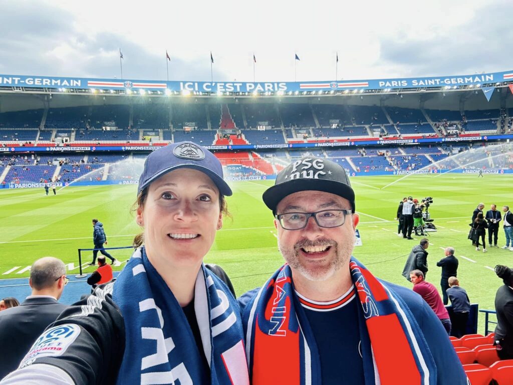 a couple celebrating their anniversary at a PSG football/soccer match in Paris